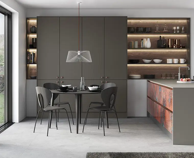 Grey and copper oxidised slab door kitchen with open oak shelves. Kitchen Interior. James-Young Kitchens & Interiors, Frome, Somerset.