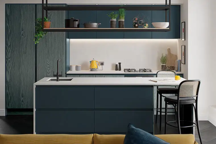 Marine blue j handle kitchen with stained woodgrain slab doors and white quartz worktops