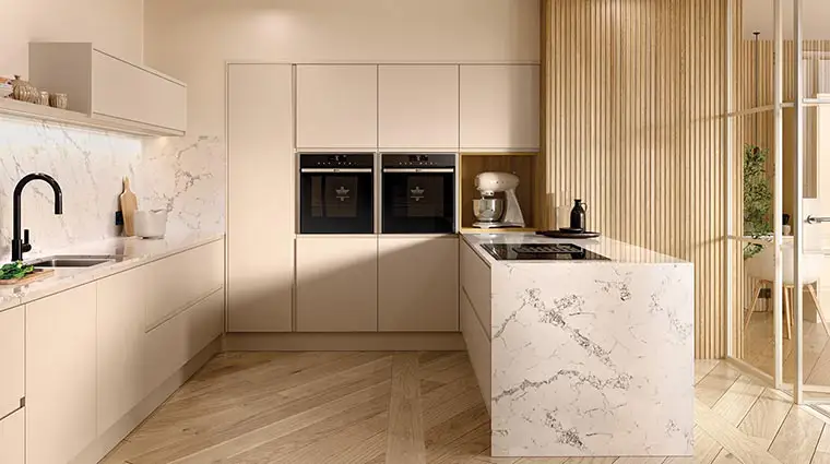 Cashmere 'J' handle kitchen with wooden floor and marble quartz worktop. Kitchens & Interiors, Frome, Somerset.